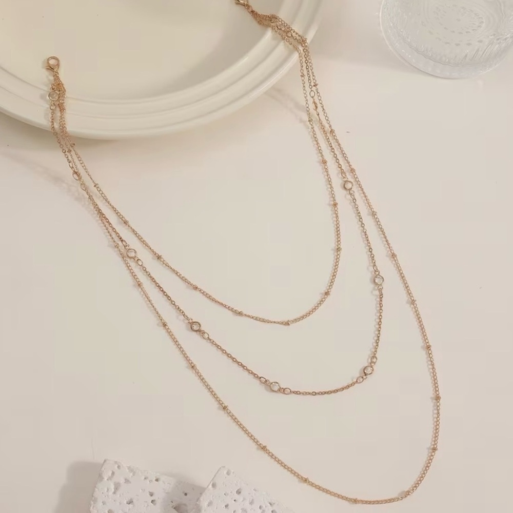 Elegant Gold Tone Multi-Layered body chain with satellite gems